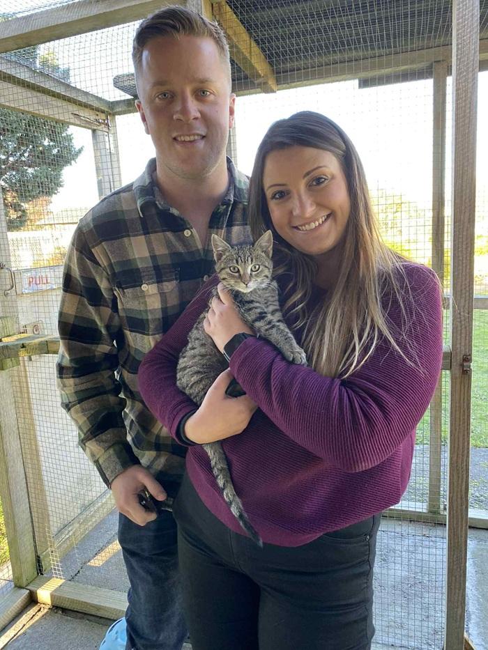 Rookie being held by new adopters